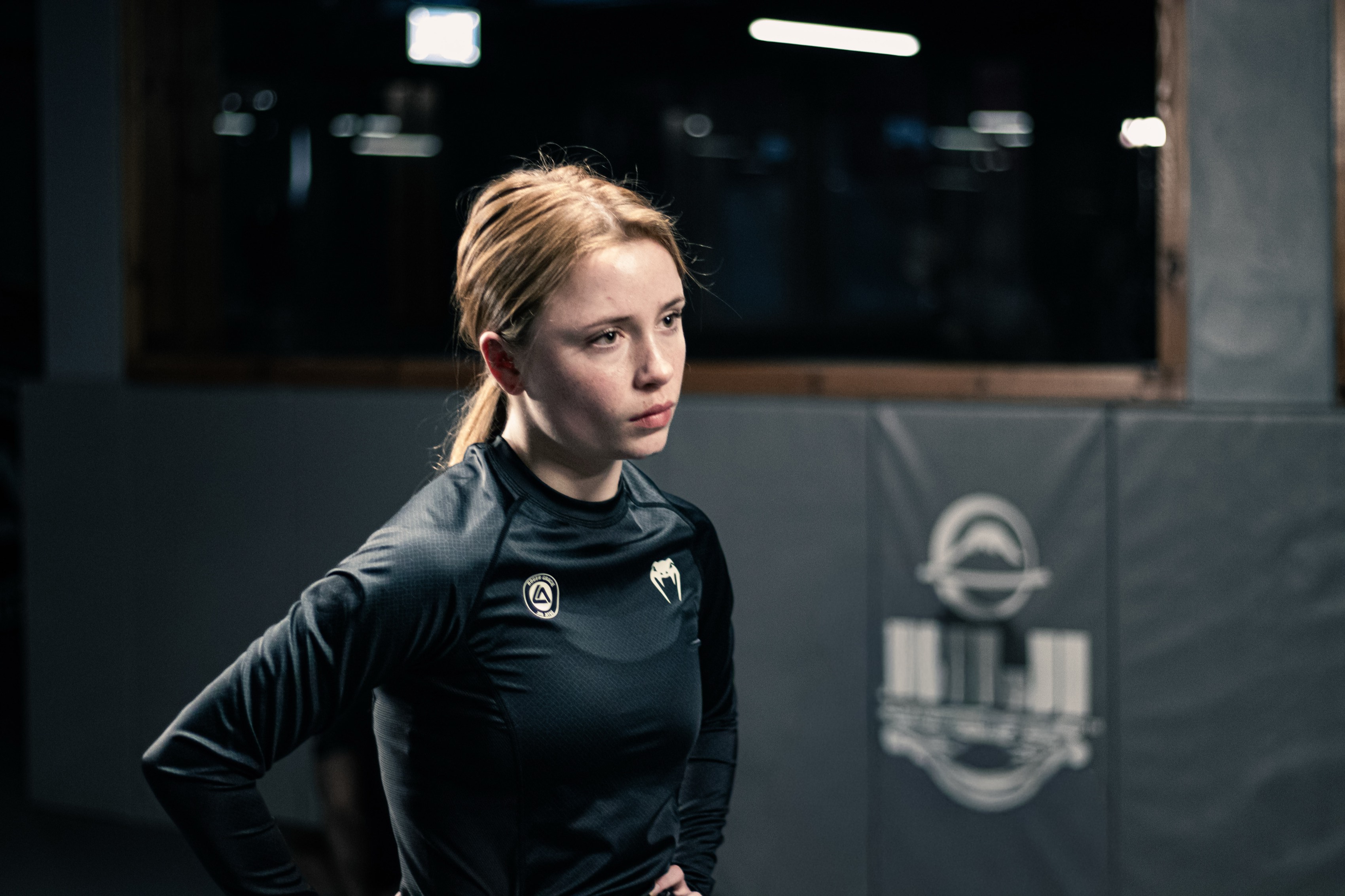 Eliza on the mat of the jiu-jitsu gym.